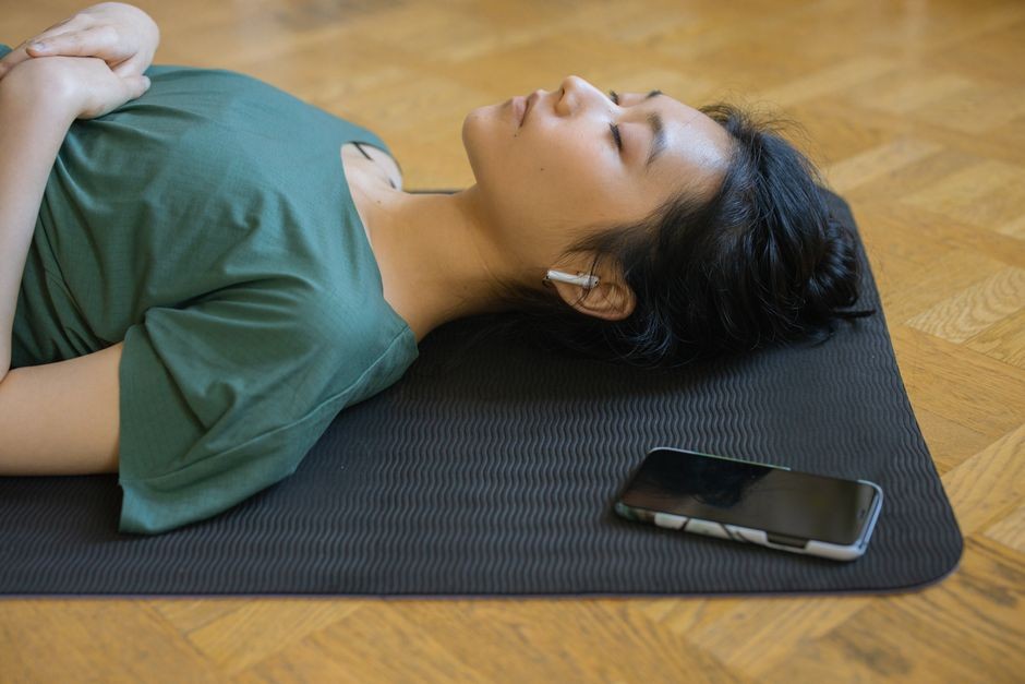 Person wearing earbuds sleeping