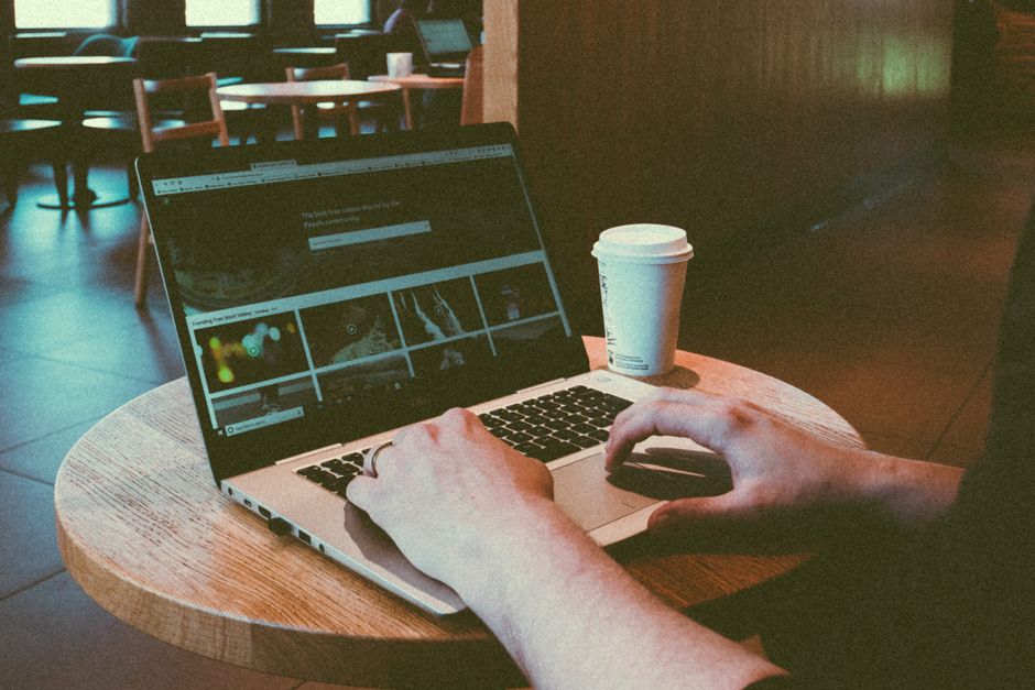 Person working laptop cafe