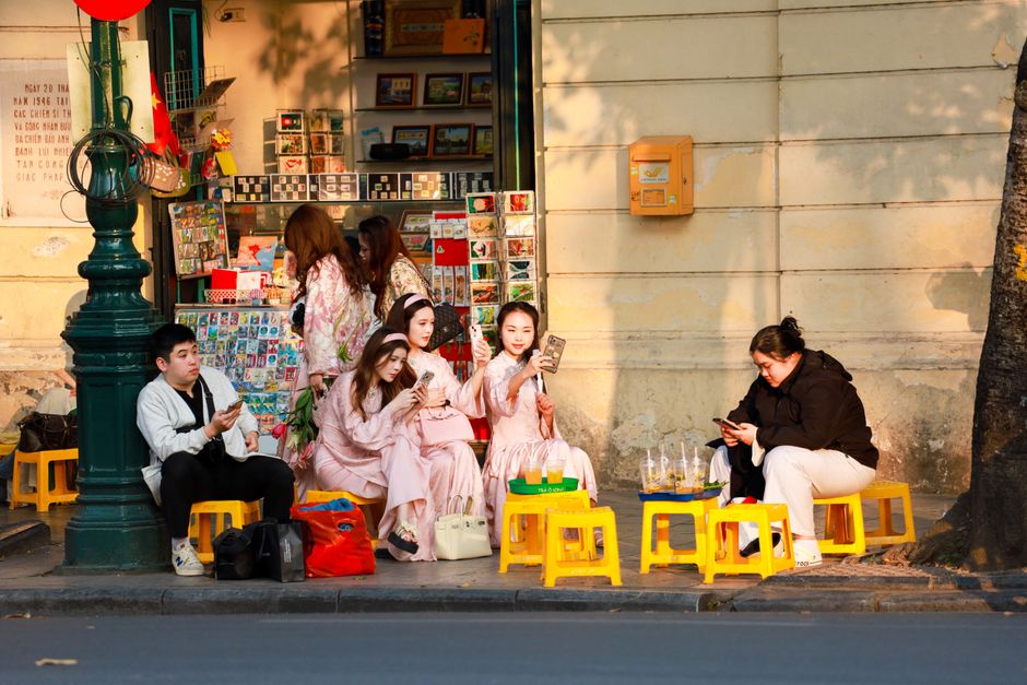 Traveler using smartphone in Hanoi street