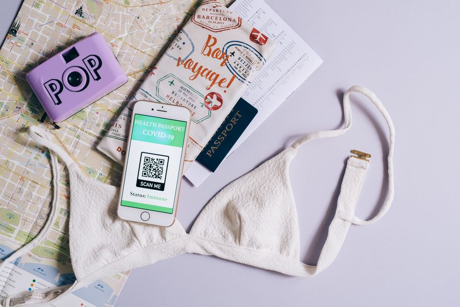 eSIM QR code on phone screen with travel background