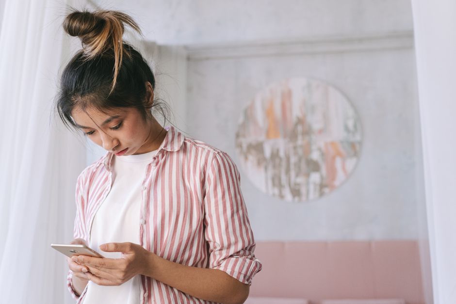 - person using smartphone for booking