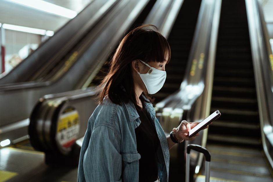Tourist using smartphone navigation at Seoul subway station
