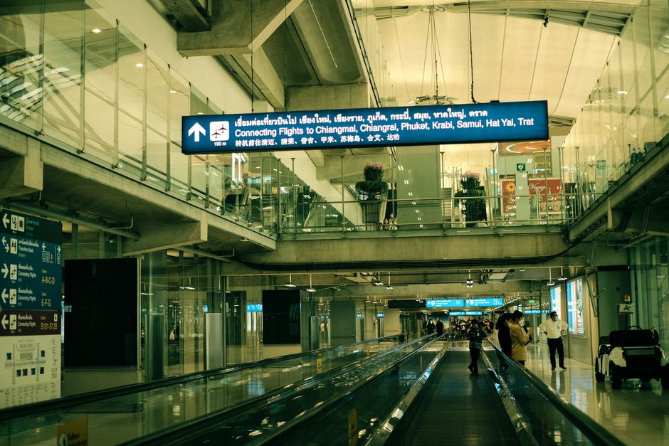 Traveler activating eSIM on phone at Suvarnabhumi Airport