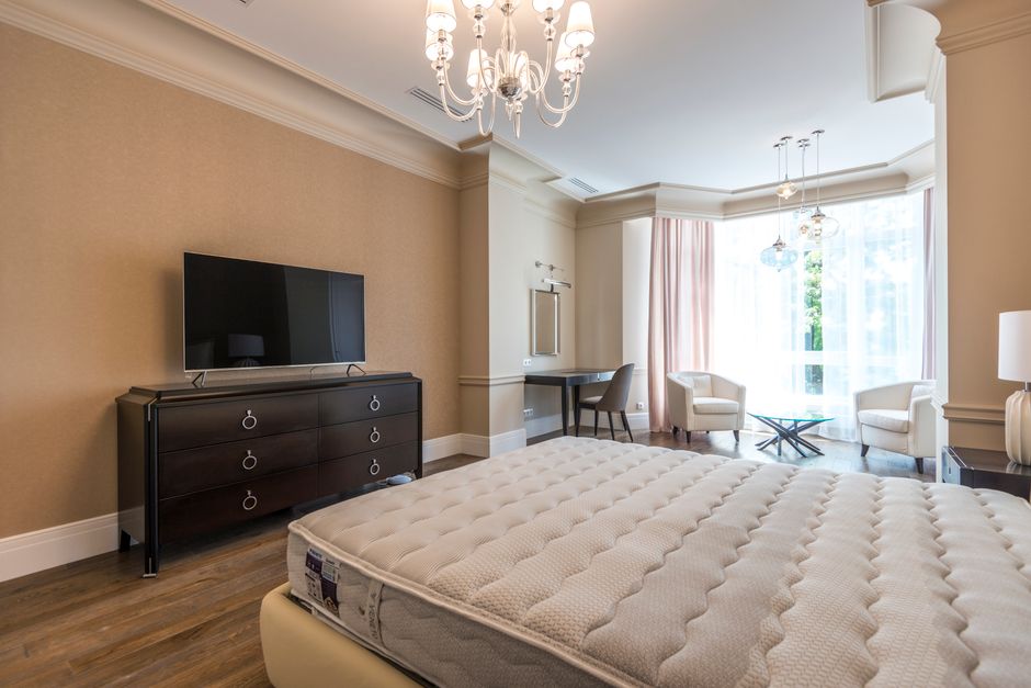 hotel room interior with mobile booking screen