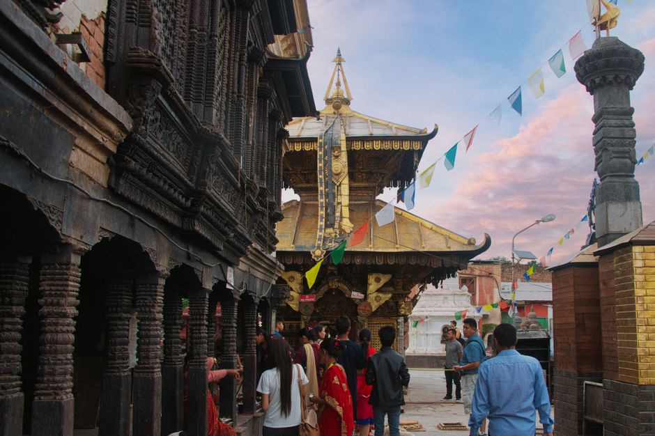 traditional wooden temple with golden stupa
